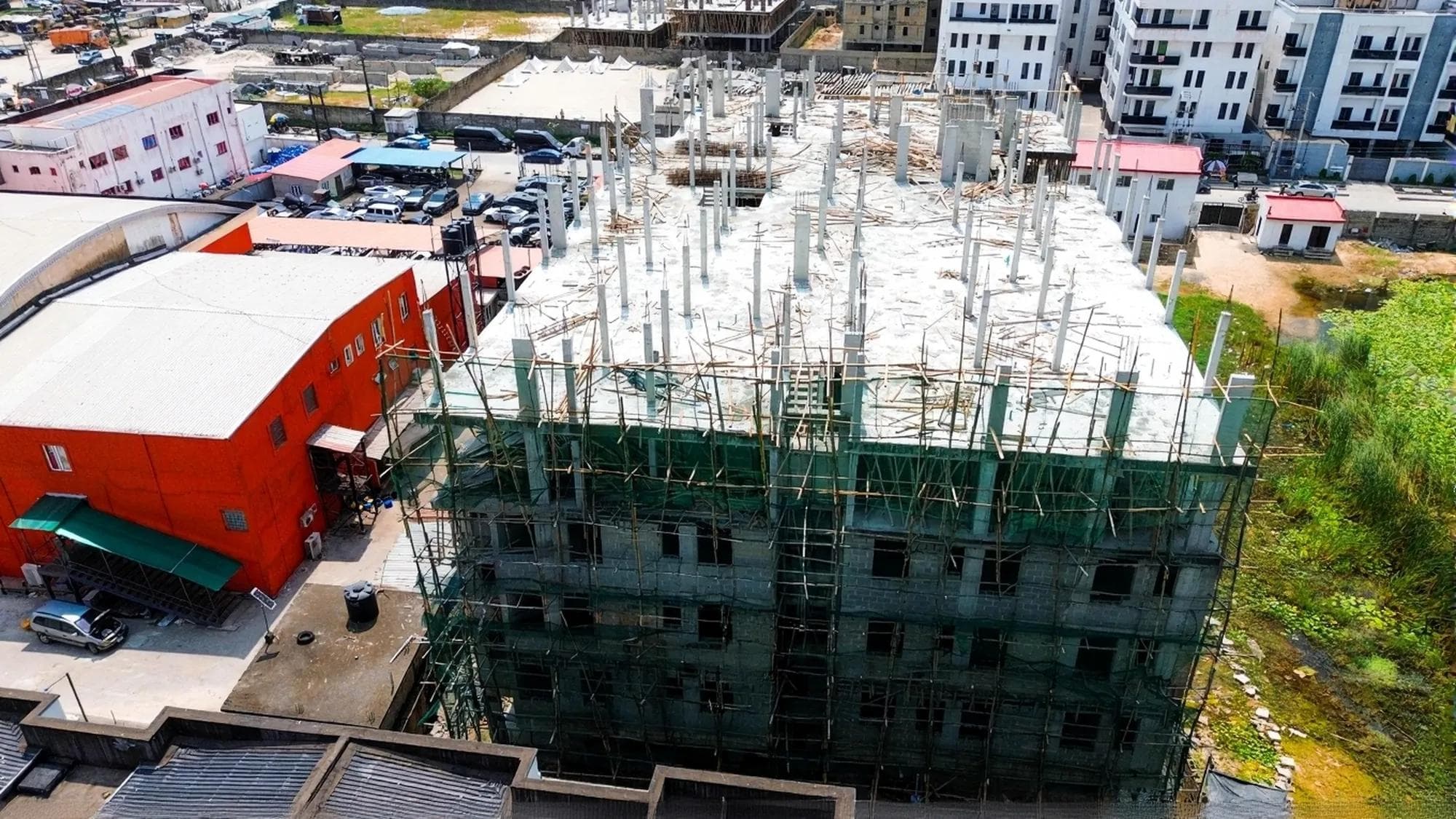 Aerial view of Hamlet Apartments under construction, scaffolding still up on the rear block