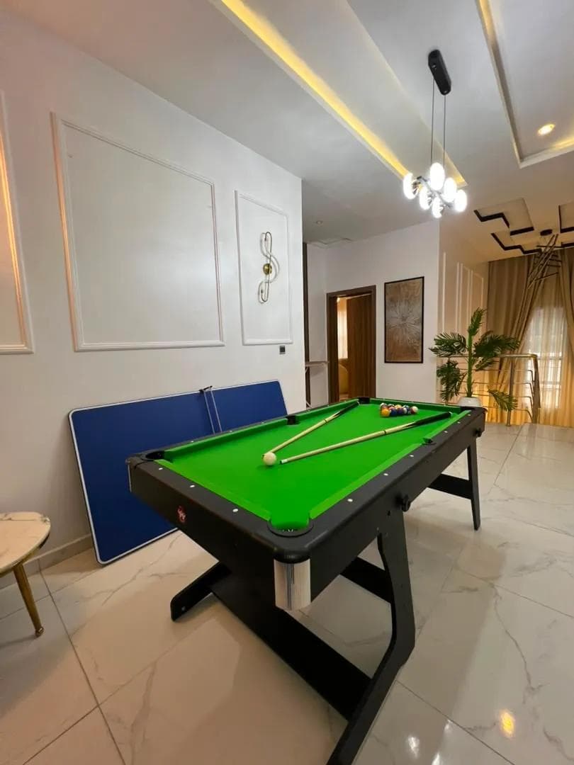 Games room with a pool table and table tennis